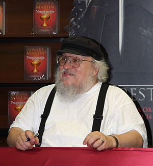 English: George R.R. Martin signing books in a...